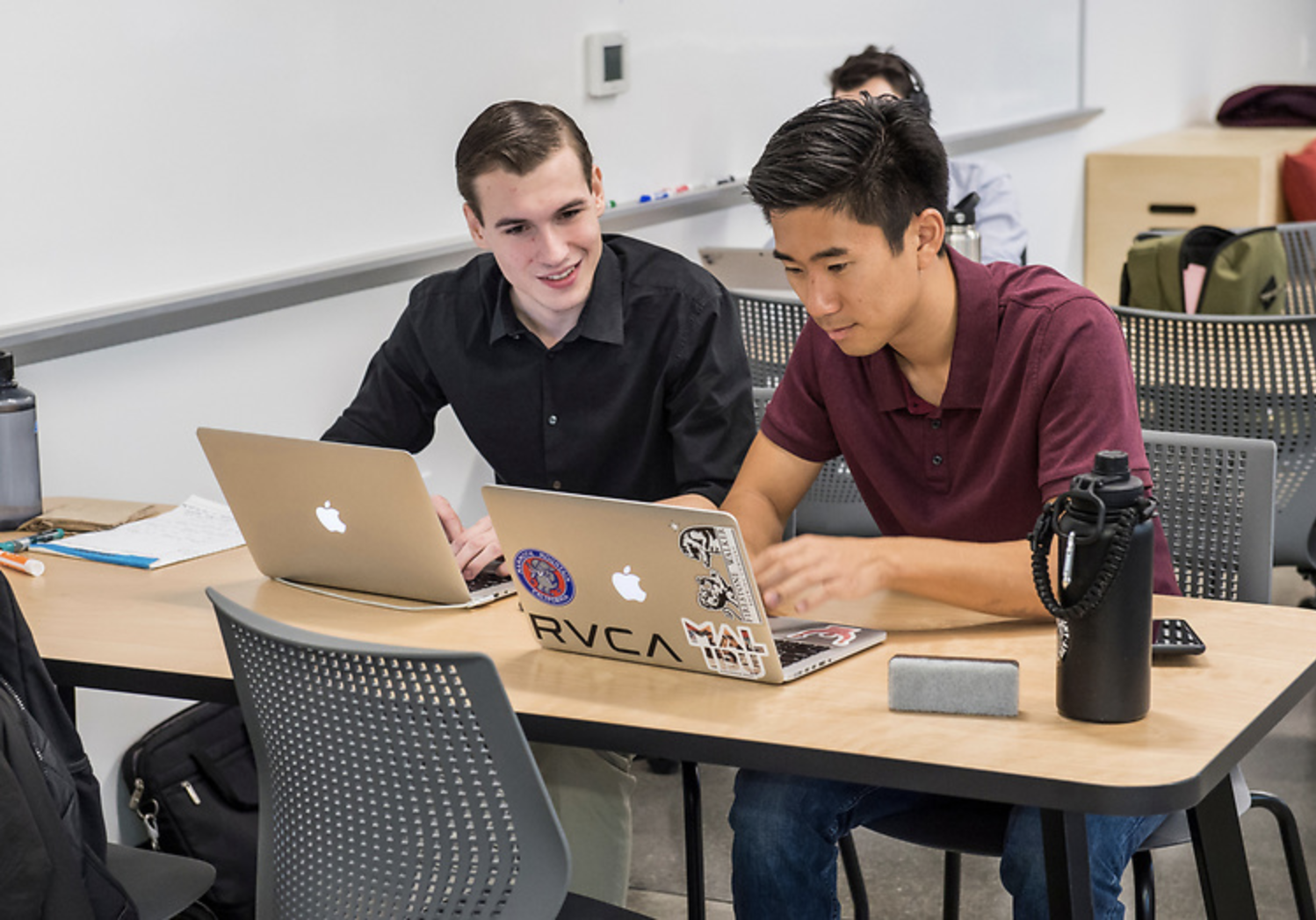 Students sitting around table