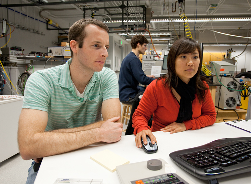 Male and female students at a computer