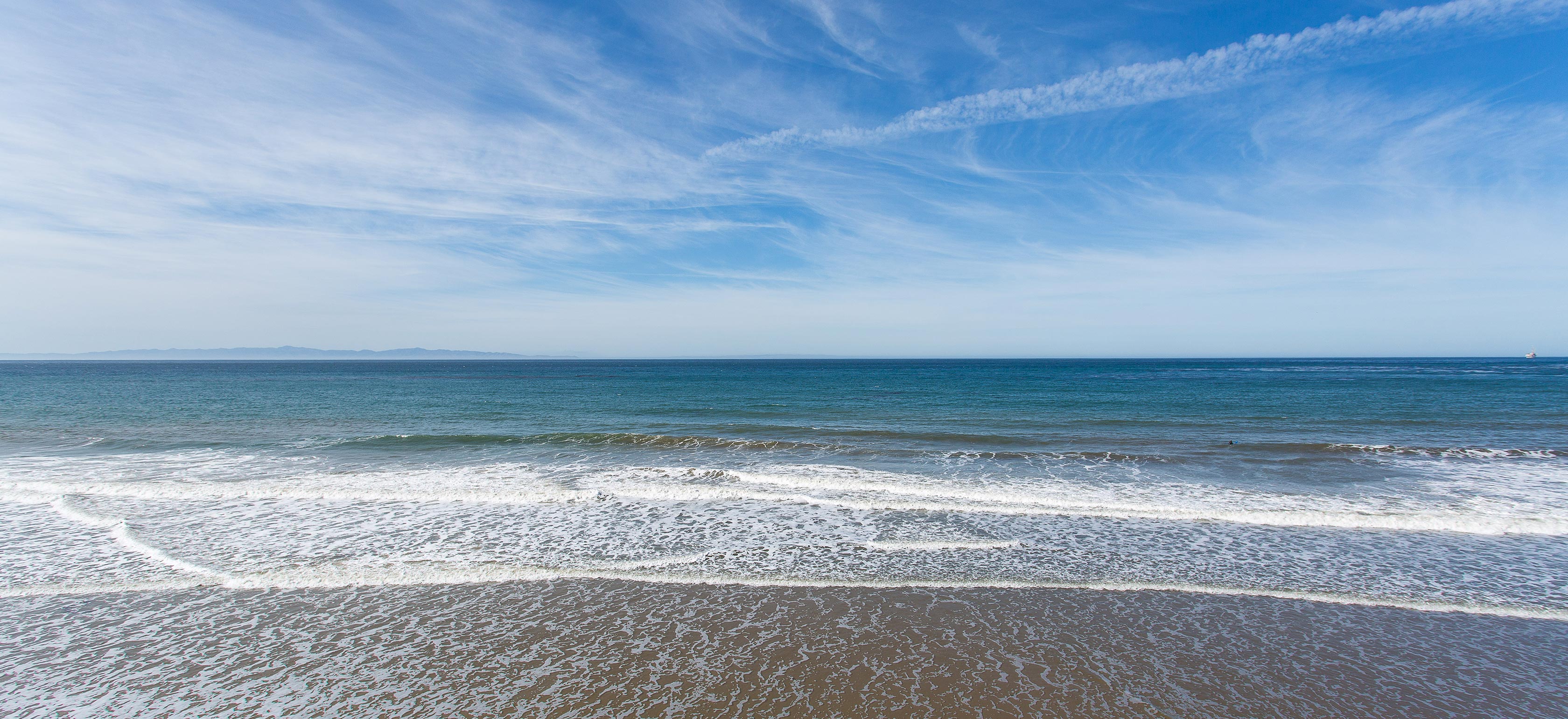 Shore, waves on the sand at the beach