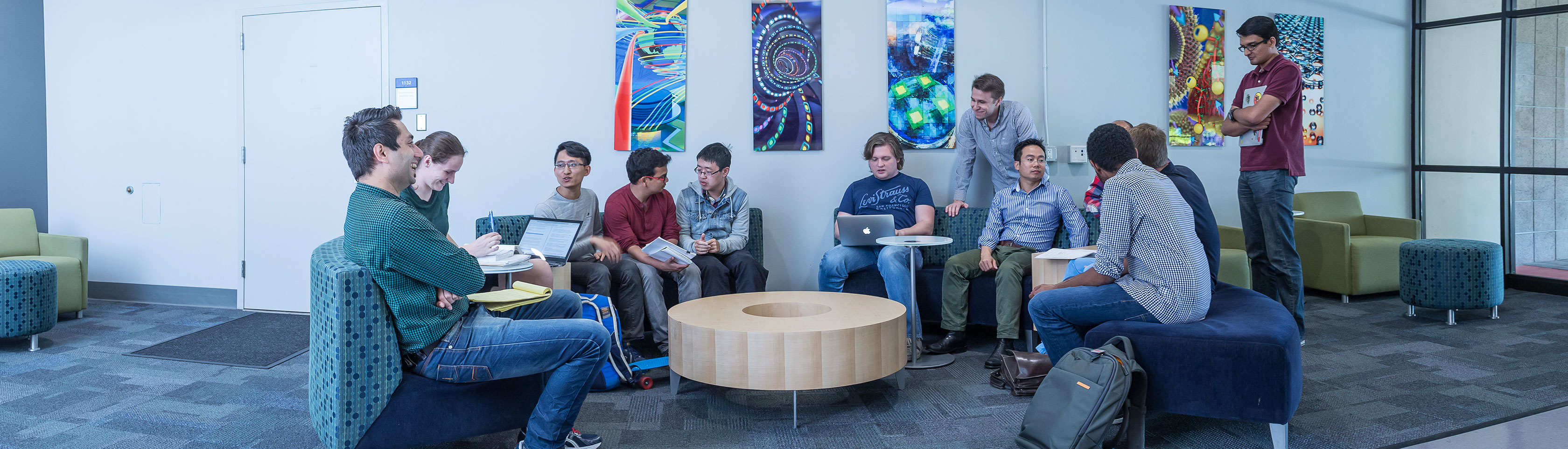 Diverse group of students talking in CNSI lobby